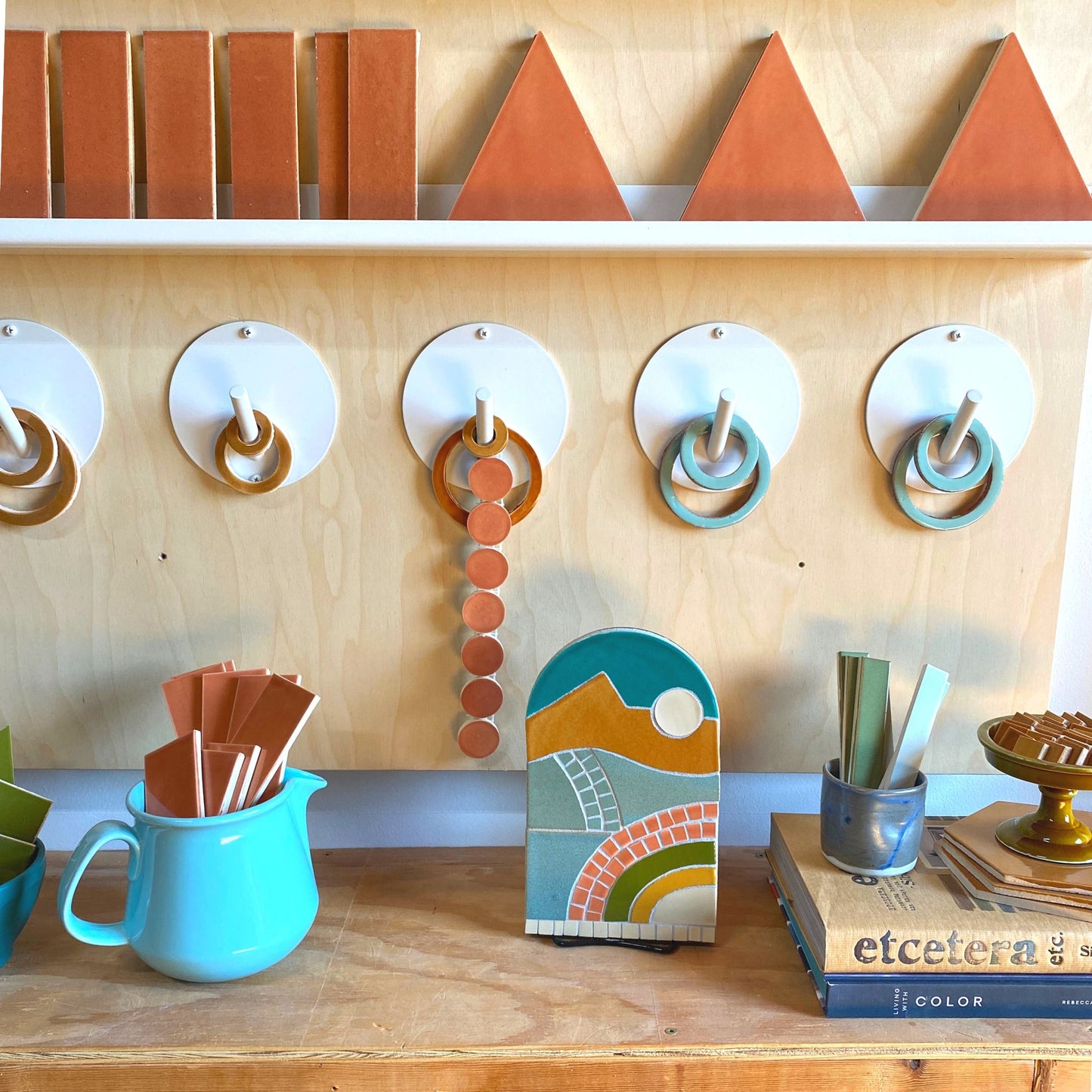 New Day Mosaic Kit in Sahara color way - assembled and styled on a bookshelf with loose tiles